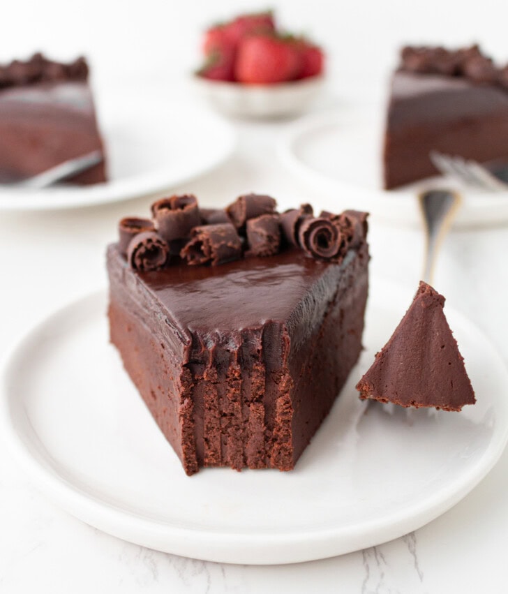 A slice of chocolate cake with chocolate frosting