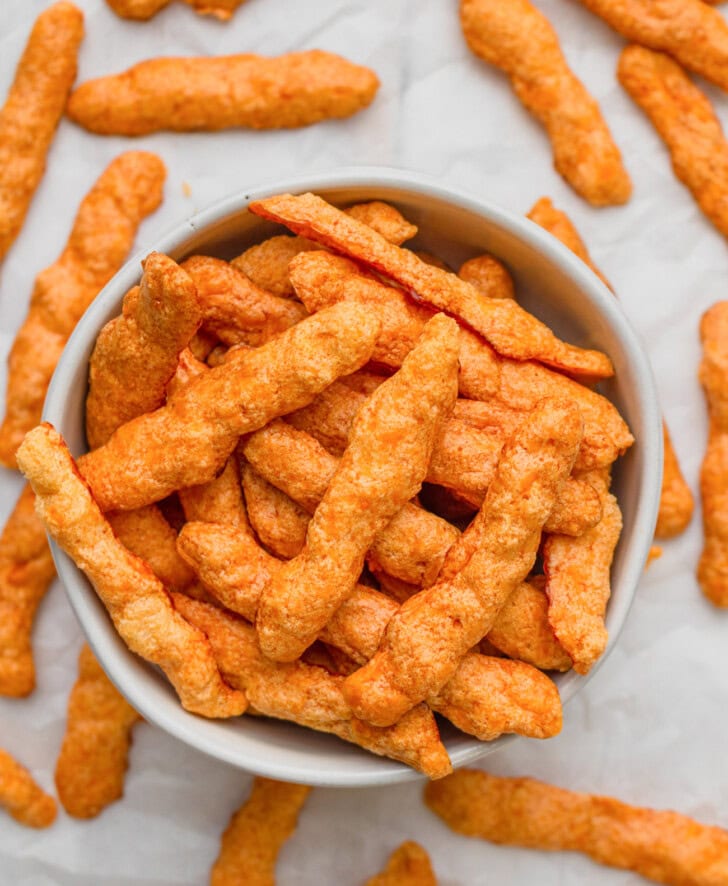 A bowl of cheese puffs