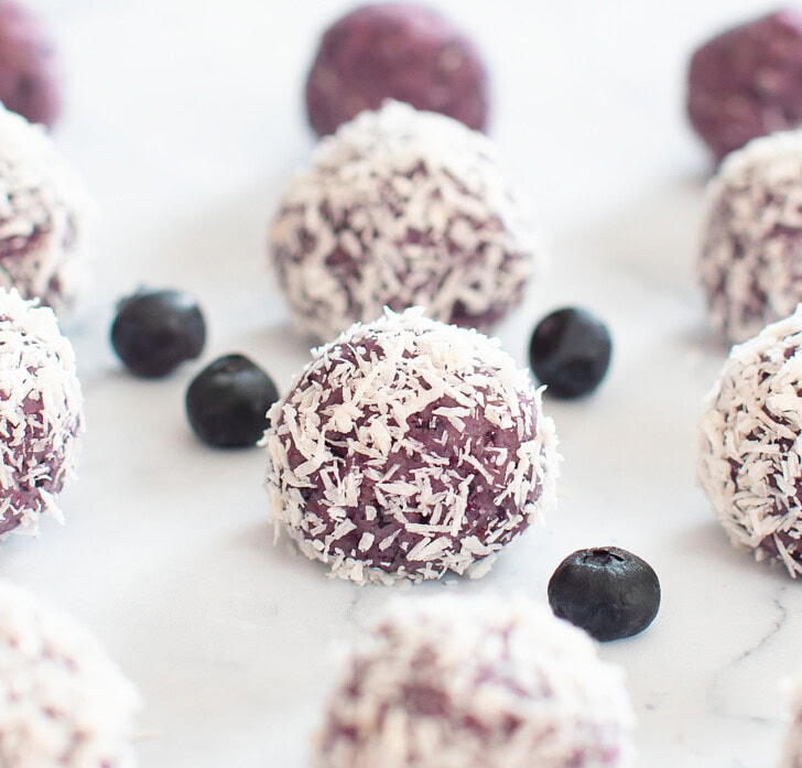 Blueberry cake balls rolled in shredded coconut
