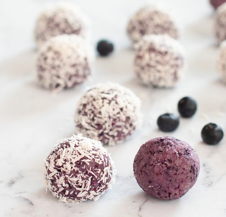 Plain blueberry cake balls and ones rolled in shredded coconut