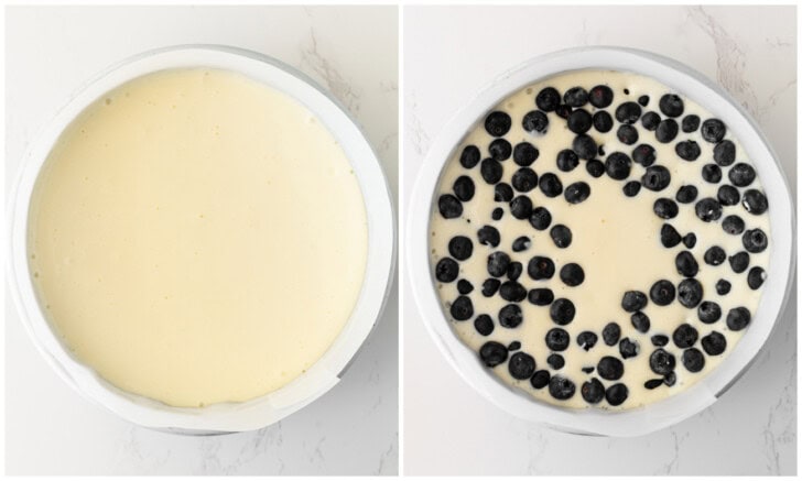 Cheesecake batter in a cake pan and topped with fresh blueberries