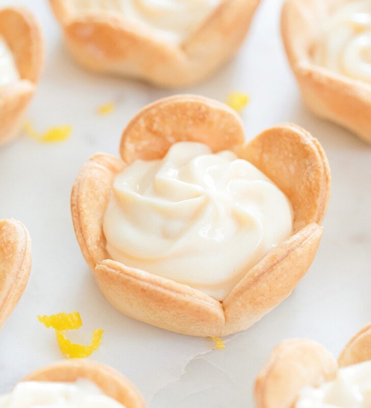 Cheesecake filling in the middle of flower shaped pie crust