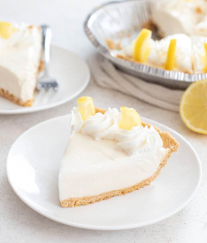 A slice of lemon yogurt cheesecake on a plate