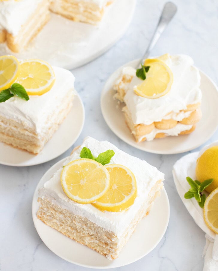 Slices of lemon cake on white plates
