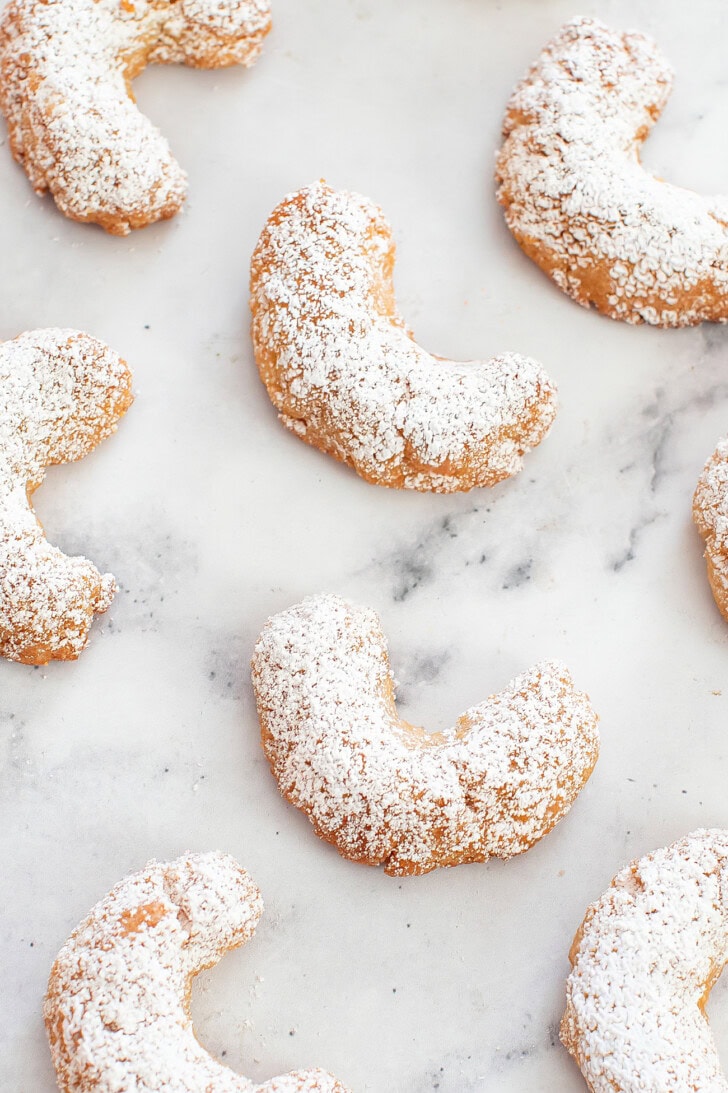 Crescent cookies dusted with powdered sweetener