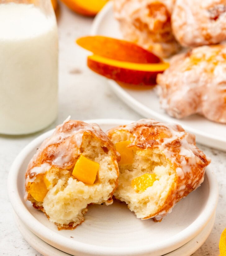 A peach fritter cut in half