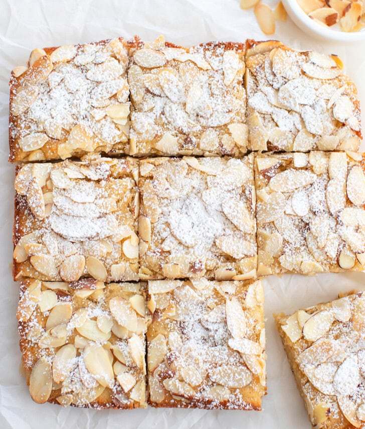Almond bars cut into squares dusted with powdered sugar