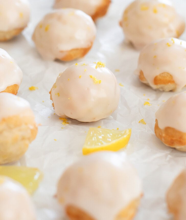 Donut holes with a lemon glaze and lemon zest on top