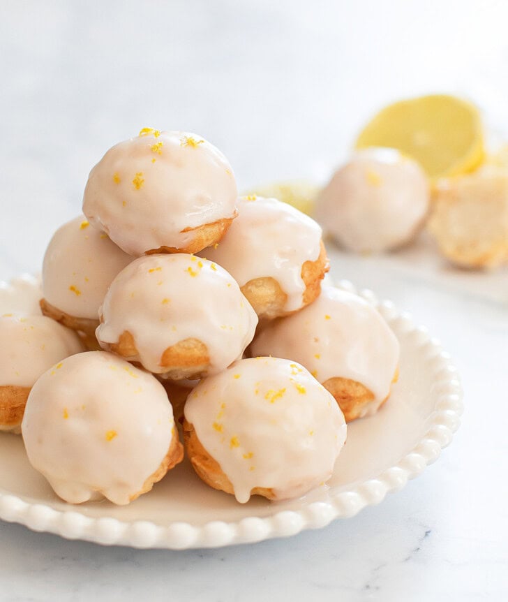 Lemon donut holes on a white plate