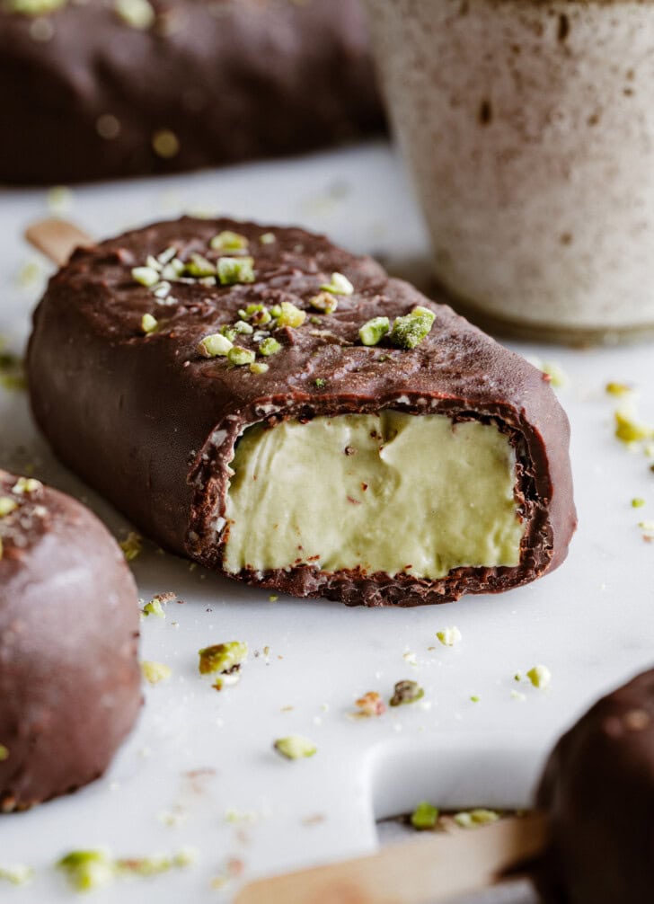 A bite taken from a Dubai chocolate ice cream bar
