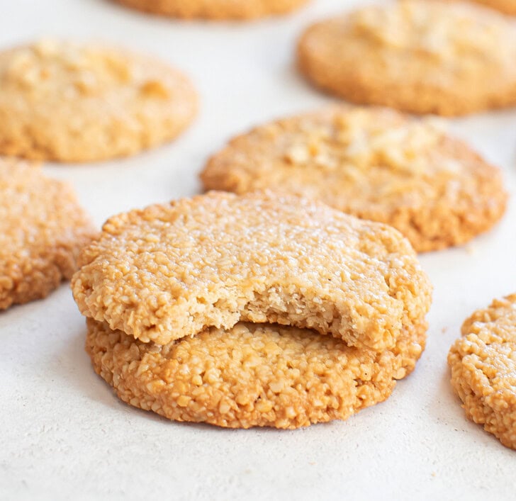 A bite taken from a cashew cookie