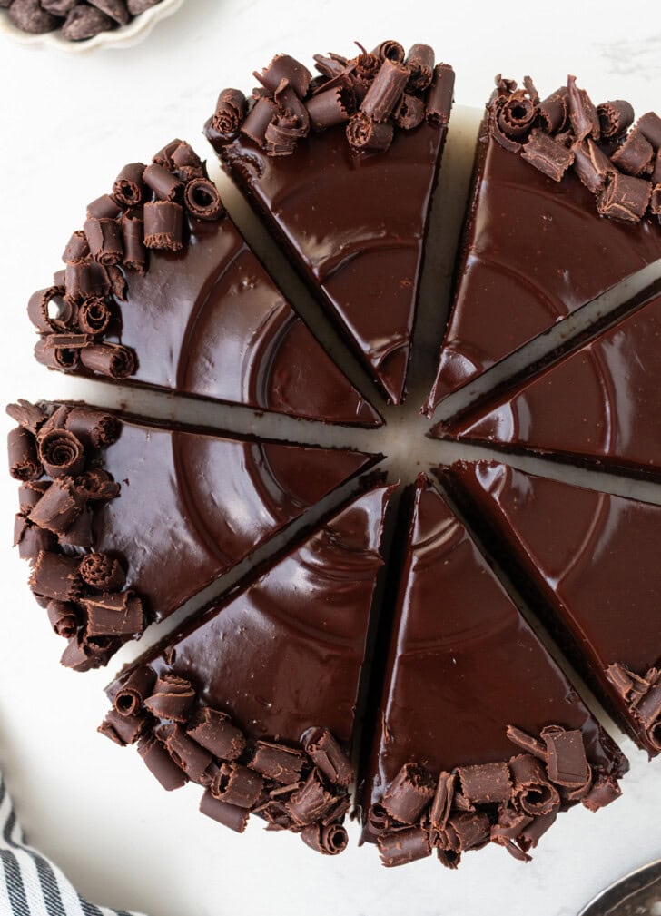 A chocolate cake decorated with chocolate ganache frosting