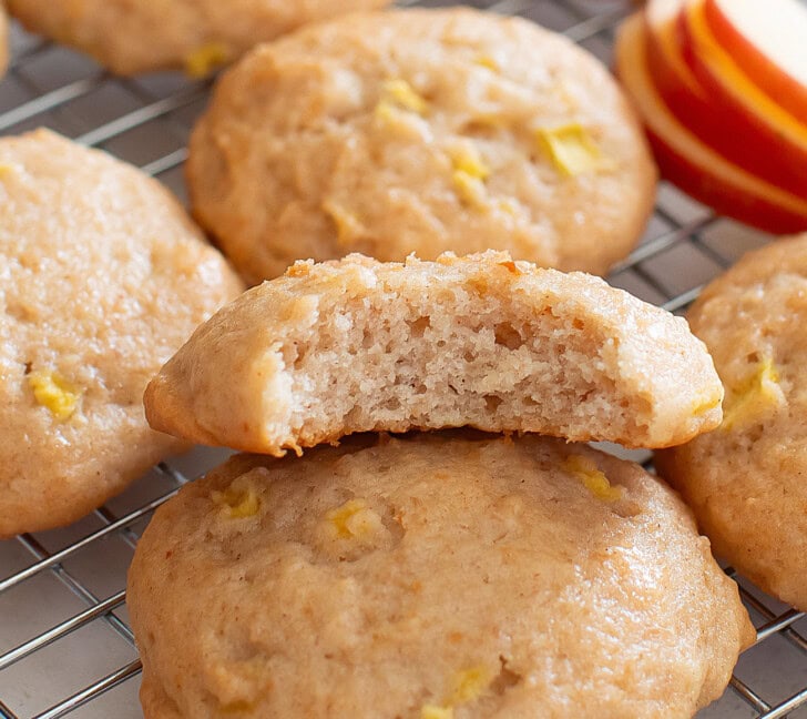 A bite taken from a soft apple cookie