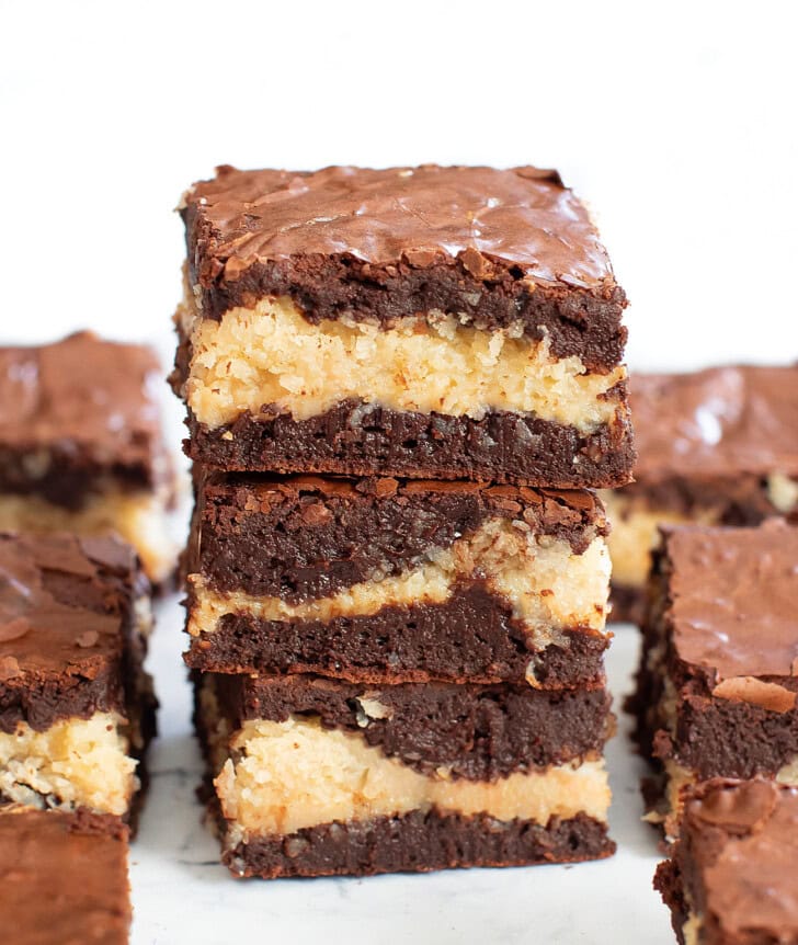 A stack of three coconut macaroon brownies