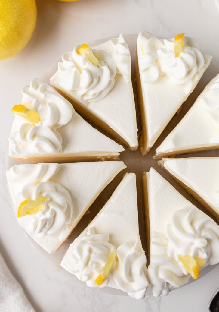 A lemon yogurt cheesecake cut into eight slices